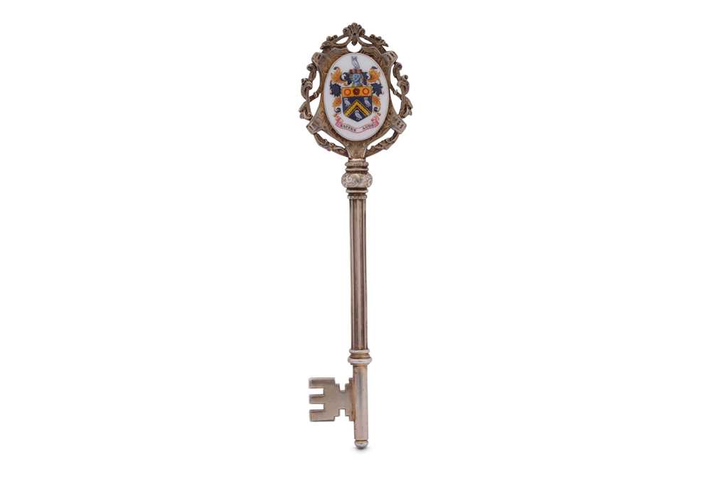 A George VI sterling silver gilt and enamel presentation key, Birmingham 1937 by Lloyd, Paine & Amie