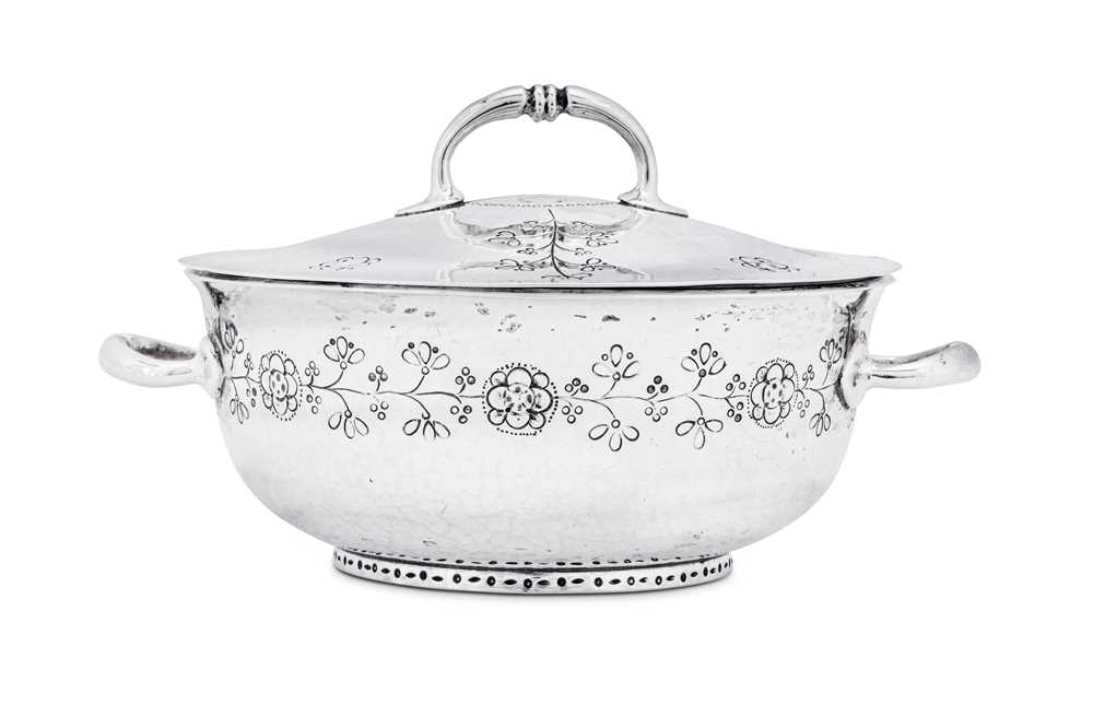 A George V ‘Arts and Crafts’ sterling silver covered twin handled bowl, Birmingham 1911 by William H