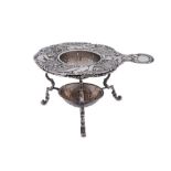 A late 19th century German cast 800 standard silver tea strainer on stand, Hanau circa 1890 by J.D.