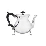 An Edwardian sterling silver bachelor teapot, Chester 1903 by Stokes & Ireland Ltd