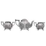 An early 20th century Anglo – Indian unmarked white metal three-piece tea service, Calcutta circa 19