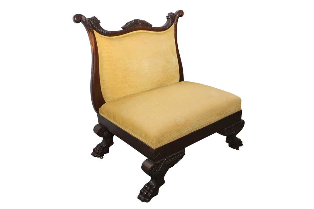 AN AMERICAN EMPIRE CARVED CHAIR
