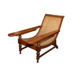 AN ANGLO INDIAN TEAK PLANTATION CHAIR, LATE 20TH CENTURY
