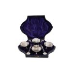 A CASED SET OF FOUR VICTORIAN STERLING SILVER SALTS AND SPOONS, BIRMINGHAM 1880 BY HILLIARD AND THOM