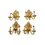 A SET OF FOUR FRENCH TASTE GILT BRONZE TWO LIGHT WALL LIGHTS, 20TH CENTURY