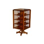 AN ANGLO INDIAN TEAK REVOLVING BOOKCASE, 20TH CENTURY