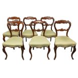A SET OF SIX VICTORIAN ROSEWOOD BALLOON BACK DINING CHAIRS