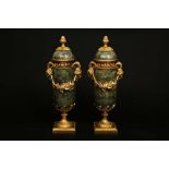 A PAIR OF LOUIS XVI STYLE GREEN MARBLE AND ORMOLU URNS AND COVERS