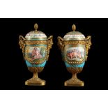A PAIR OF 19TH CENTURY FRENCH SEVRES STYLE PORCELAIN AND ORMOLU MOUNTED URNS AND COVERS