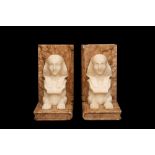 A PAIR OF ART DECO PERIOD EGYTIAN REVIVAL MARBLE BOOKENDS