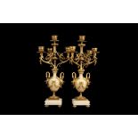 A PAIR OF LATE 19TH CENTURY FRENCH GILT BRONZE AND ALGERIAN ONYX CANDELABRA