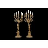A LARGE PAIR OF NAPOLEON III STYLE GILT METAL FIGURAL CANDELABRA