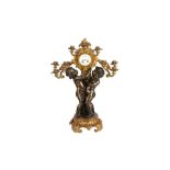 A FINE NAPOLEON III GILT AND PATINATED BRONZE CANDELABRA CLOCK BY JULES GRAUX, PARIS, CIRCA 1860