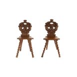 A PAIR OF 19TH CENTURY FRENCH OAK HALL CHAIRS CARVED WITH CARYATIDS IN THE 17TH CENTURY STYLE
