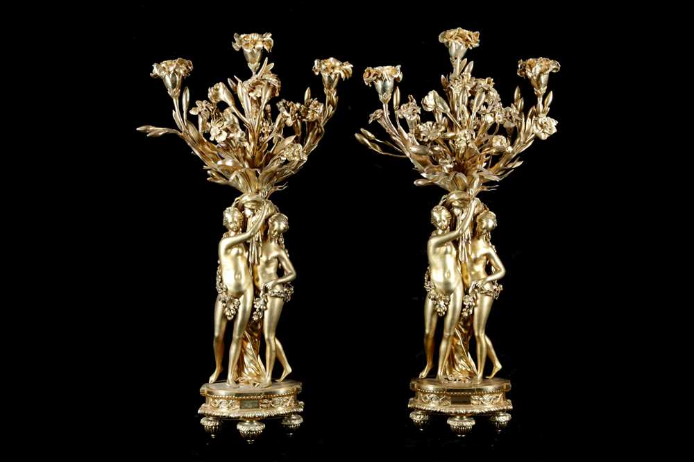 A LARGE PAIR OF 19TH CENTURY FRENCH GILT BRONZE FIGURAL CANDELABRA AFTER THE MODEL BY ETIENNE-MAURIC