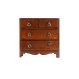 MINIATURE FURNITURE: A REGENCY MAHOGANY AND BOXWOOD STRUNG CHEST OF DRAWERS