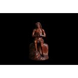 A 17TH CENTURY GERMAN CARVED BOXWOOD FIGURE OF CHRIST ON THE COLD STONE