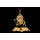 A LOUIS XV STYLE GILT AND PATINTED BRONZE CLOCK MODELLED WITH A BULL