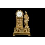 AN EARLY 19TH CENTURY FRENCH EMPIRE PERIOD GILT BRONZE FIGURAL MANTEL CLOCK