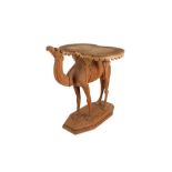 AN EARLY 20TH CENTURY ANGLO INDIAN TEAK TABLE MODELLED AS A CAMEL