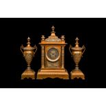 A LATE 19TH CENTURY FRENCH GILT AND SILVERED BRONZE CLOCK GARNITURE