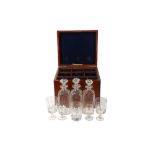 AN EARLY 19TH CENTURY MAHOGANY CELLARATTE BOX WITH DECANTERS AND GLASSES