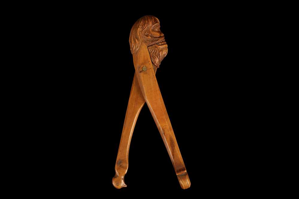 AN 18TH CENTURY FRENCH FRUITWOOD NUTCRACKER IN THE FORM OF A WILDMAN