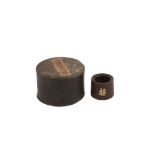 A CHINESE INSCRIBED AND GOLD-INSET AGARWOOD ARCHER'S RING.