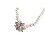 A cultured pearl necklace with a diamond spacer