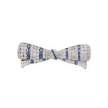 A sapphire and diamond bow brooch, circa 1950