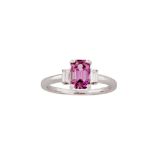 A pink sapphire and diamond ring