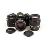 Black Nikon FE2 with 50mm & 105mm Lenses.