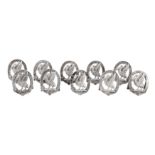 A set of ten Victorian sterling silver place card holders, four London 1882 by Edward H Stockwell an
