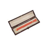 A late 19th century 14 carat gold mounted coral propelling pencil, English or American circa 1890