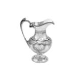 A Victorian sterling silver milk jug, Birmingham 1870 by Horace Woodward & Co