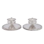 A pair of Elizabeth II combination dwarf candlesticks and tapersticks, Sheffield 1957 by Walker and