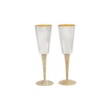 A pair of Elizabeth II modernist sterling silver parcel gilt goblets or champagne flutes, London