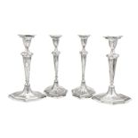 A set of four George III sterling silver candlesticks, Sheffield 1788 by George Ashforth & Co, two o