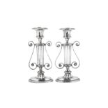 A pair of Edwardian sterling silver candlesticks, Birmingham 1903 by Israel Sigmund Greenberg and