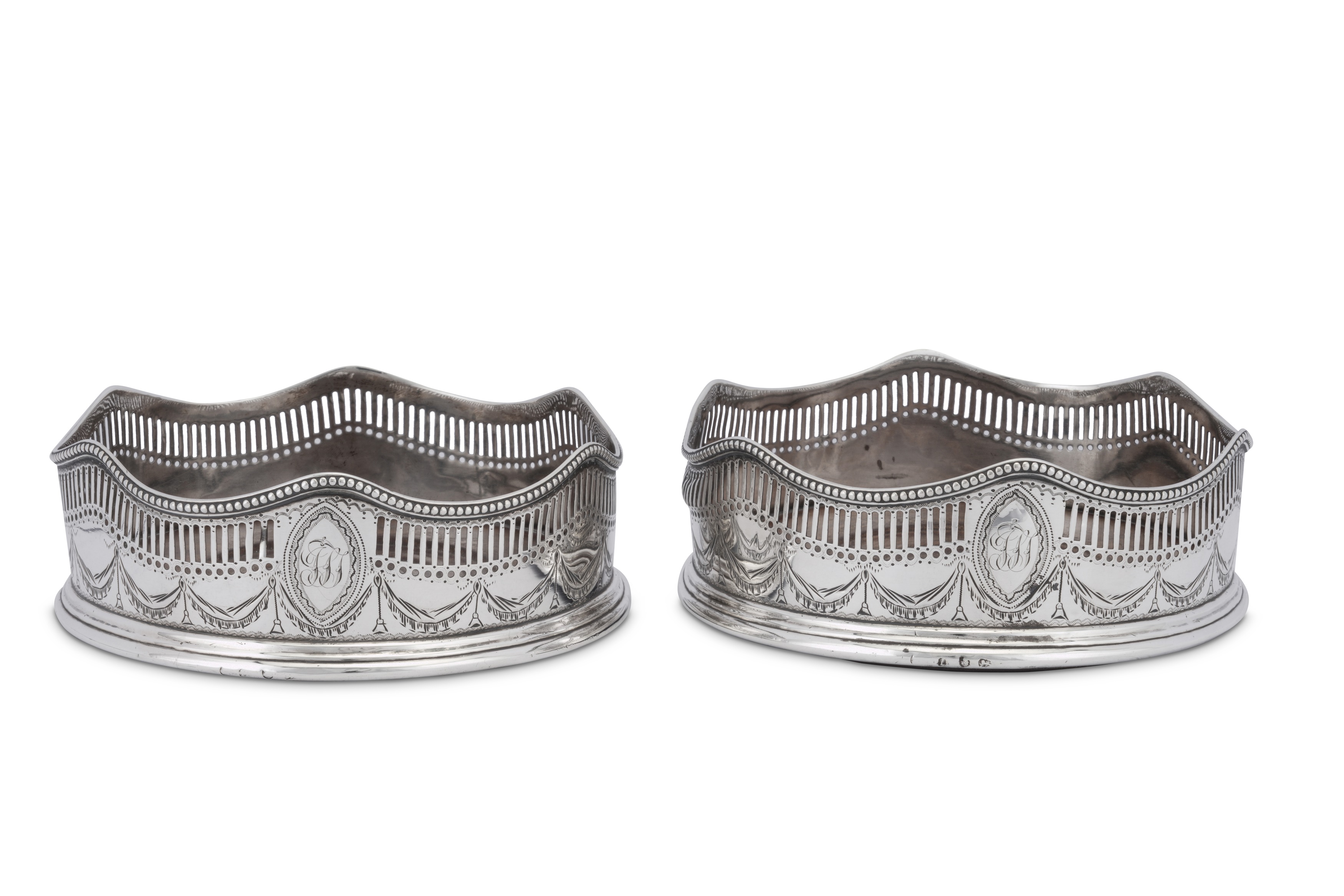 A pair of George III sterling silver wine coasters, London 1788 apparently no maker’s mark