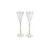 A cased pair of Elizabeth II modernist sterling silver parcel gilt goblets or champagne flutes, Lond