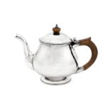 An Elizabeth II sterling silver ‘hand crafted’ teapot, London 1980 by The Guild of Handicraft