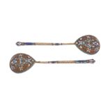 A pair of Nicholas II Russian 84 zolotnik silver gilt and cloisonné enamel spoons, Moscow 1908-14