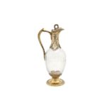A mid-19th century French unmarked silver gilt mounted claret jug, probably Paris circa 1860