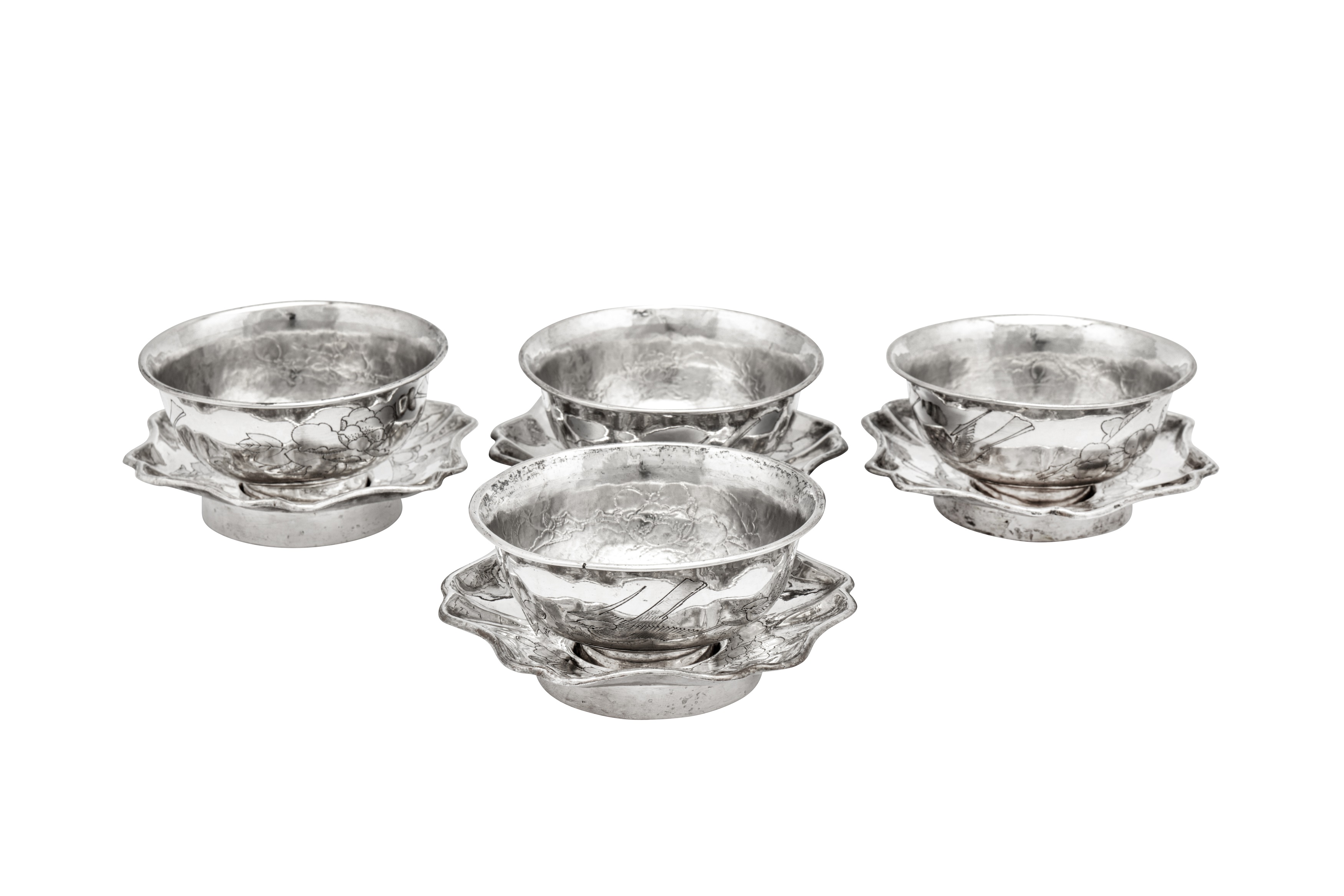 A set of four early 20th century Chinese Export silver tea bowls and saucers, Tianjin circa 1920 by