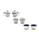An Edward VIII 'Arts and Crafts' sterling silver six-piece cruet set, Birmingham 1936 by Liberty and