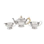 A George V Art Deco sterling silver three-piece tea service, London 1931 by Charles Boyton