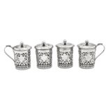 A set of four early 20th century Chinese Export silver tea glass holders and covers, Tianjin circa 1
