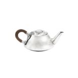 A George V 'Arts and Crafts' sterling silver bachelor teapot, Birmingham 1912 by Liberty and Co