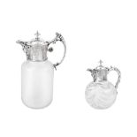 AMENEDED DESCRIPTION: TWO SILVER MOUNTED GLASS CLARET JUGS